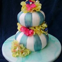Striped Donut Cake This cake was inspired by the Colette Peters style donut cakes. I love the process of carving the cake and painting the fondant. To save...