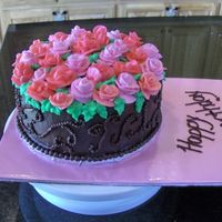 Red And Pink Roses red and pink btr crm roses. choc. icing. freehand scroll work on the side.