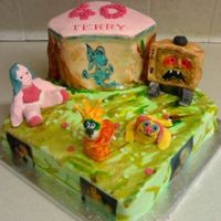 Willow The Wisp 12inch vanilla cake with a scene from old british cartoon willo the wisp, birthday girls pet name was Evil edna as was toon in show