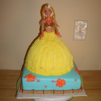 Luau Cake 8th birthday cake for my Niece. She had a luau party so I made the luau Barbie with the Wilton Doll pan and a 8" square for the base....