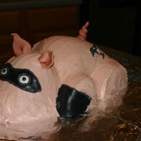 Incredi-Pig Cake covered in buttercream with fondant accents.