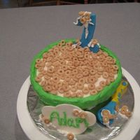 Cherrios First Birthday I got the idea for this cake from here: http://www.flickr.com/photos/14559934@N04/1848951035/ . The cake is white cake covered in...