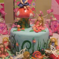 Garden Fairy Party I made this for my dsughter's Birthday. Chocolate cake with chocolate chip buttercream. Everything is made out of fondant except wings...