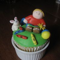 A Boy's Favorite Things A made this large cupcake decorated with my 4 year old's favorite things -- a bunny, crayons, beach ball, worms and a baseball (in...