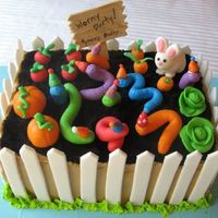 Wormy Garden Party W Fence This was party number two. This time I did the cake with a gum paste fence. Much easier than the fondant grass.