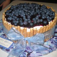 Blueberries And Pirouette Cookies This is a double layer 10" doctored yellow cake. It is iced in buttercream, and filled with blueberry pie filling mixed with...