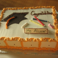 Teacher Graduates yellow cake/pina colada filling w/nuts/whipped frosting. sister in law graduation cake with fondant accents everything is edible