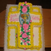 166.jpg 1/2 sheet vanilla cake with bc icingcut out cross cake on top