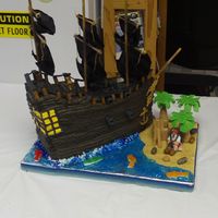 Black Pearl, Pirates Of The Caribbean Dark chocolate fudge cake, peanut butter filling, BC icing (not chocolate). Fondant accents and some RI (ships wheel, anchor, and woman at...