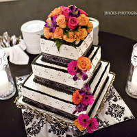 Black And White Wedding wasc cake.... black ribbon and silver dragees