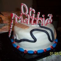 Doctor Cake Made for my then-doctor, with "pills" around the edge, two band-aids, and a stethoscope and a medical cross