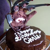 Freddy Krueger Glove Cake My brother requested this cake for his birthday. I borrowed the glove from him, stuffed it with tissue and used pink fondant as the "...