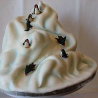 Penguin Playground This was my Christmas cake. I had a snow theme going on. Its' white cake and buttercream with fondant covering. This was my first...
