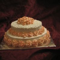 Roses, Roses, Roses Oval white layers with buttercream. Buttercream roses were made in advance and dried for ease of placement. I wanted to practice my rose-...
