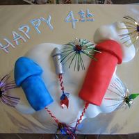 July 4Th Rockets White cake w/ buttercream, covered in fondant. Cake parts were carved and covered in fondant. Cake was not quite dense enough to hold the...
