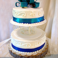 Engagement Party Cake Basic tiered cake w/ hand-made blue fondant ribbon.