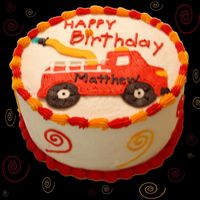 Fire Engine Cake This was a red velvet & yellow cake baked with the Wilton checkerboard cake pan set. The cake was iced with buttercream and blue...