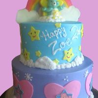 Care Bear Rainbows Birthday Cake I got some inspiration from different cakes on here as well as the party decor. The rainbow is colored candy melts, and the stars and heart...