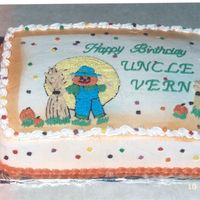 Scarecrow.jpg scarecrow and moon are out of a coloring book that I traced onto the cake. I sprayed the outline with the edible orange spray using a...