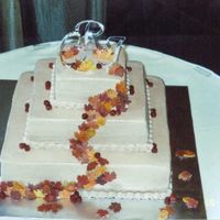 Weddingfallcakechrisjess2.jpg Closer look at the leaves and cranberries for the square Fall wedding cake with fondant fall leaves and fondant cranberries