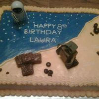 Wall E Cake Made this for my daughters birthday. Vanilla cake butter cream icing. Mini chocolate candy bars for squares of trash.M&Ms for rocks.