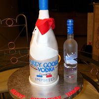Grey Goose Vodka Cake covered in fondant and fondant accents. The bottle is all cake and the neck is fondant.