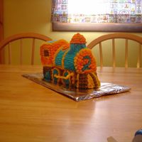 3-D Train Cake This was my first cake ever before taking the Wilton class. My son wanted a choo choo cake for his 2nd birthday so I went all out and got...