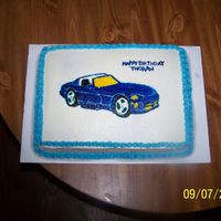 000_0550.jpg I hand painted this car onto the buttercream for a friends son's 1st birthday.