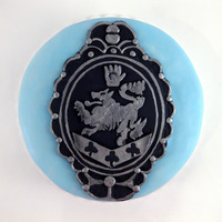 Twilight Cullen Crest Cake I made this cake in honor of the Cullen Crest created for Twilight! The cake was red velvet with vanilla buttercream. The blue was brushed...