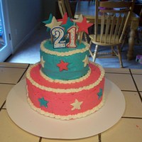 21St Birthday Cake This cake was for my sister's 21st bday. The stars are made out of fondant and the frosting is buttercream.