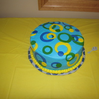 Fondant Circle Cake This was for a baaby shower but I don't think it looks much like a baby shower cake. It was buttercream with fondant circles.