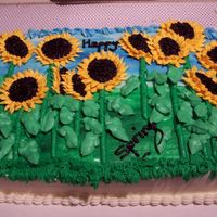 Sunflowers This is a cake I did in one of my cake classes, getting to the major flower making. I had fun with this one. Love Sunflowers.