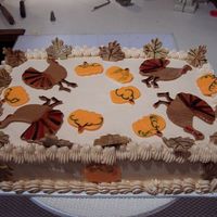 Thanksgiving Day Party 1st time making MMF, decided to make cut outs & painted them w/corn syrup/gel color mix. Cake is cherry chip w/raspberry filling,...