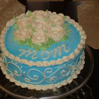 Blue And White Birthday Cake French Vanilla Cake with sky/royal blue coloring - ivory scrolls on sides.