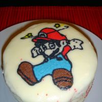 Mini Mario Cake This is a practice cake. I wanted to try doing a transfer using buttercream frosting. The cake is about 4 inches wide and 3 1/2 inches tall...