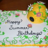 Summer Birthday Cake This cake was done for a church to celebrate everyone's birthday for the month. It is all cake with fondant flowers and bees.