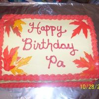 Autumn Themed October Birthday Cake b/c icing, mmf leaves, french vanilla/yellow 2 layer cake. Was made for my Pa's 74th birthday. Fall theme, hubby picked maple leaves (...