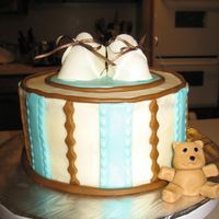 Baby Bootie Cake italian cream cake w/ cream cheese icing with mmf accents. the bear and booties are also made from mmf.