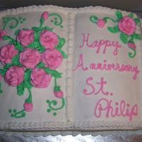 Bible Cake Church Anniversary 2 mix book pan, buttercream roses and decorations; used Hershey Kisses as bases for the roses. Used pan insert for inspiration.