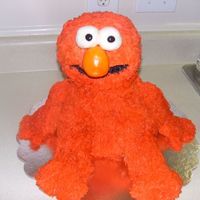 Elmo Cake This was a challenge gosh i am glad to be doen with this cake, What could go wrong did with this cake lol..The buttercream did not want to...