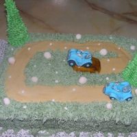 Atv Cake This was done for a 9 year old whos 9th B-day it was....He loves ATV'S and she wanted something going off a jump...Thanks for looking...