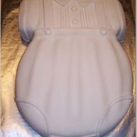 Boy Romper This was made to look like the outfit the boy will wear. All fondant.