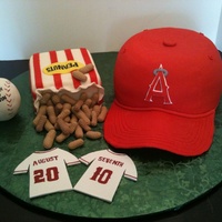 Angels' Baseball This was for a wedding shower, where the engaged couple were huge Angels' fans. Cap and Peanuts Box are cake covered in fondant....