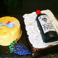 Wine Cheese Groom's Cake Groom's cake for a wine themed wedding. Bottle, crate and cheese are cake. All covered in fondant. Gumpaste/fondant mice/grapes..Groom...
