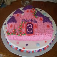 Castle Cake Wilton castle pan on top of 14 inch round cake. Friend wanted the bottom cake to have polka dots for the birthday girl!