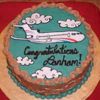 Graduation Cake Tiramisu cake w/ coffee buttercream and colorflow airplane colored w/ food markers.