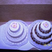 Mini Cakes Tasting I have to do 90 of these for her wedding. YIKES! Used Candy Coating and CK cake molds.White choc cake w/ a little raspberry buttercream...