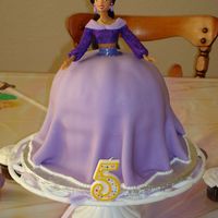 Princess Jasmine Cake Princess Jasmine Cake. Dress is covered in lavender fondant and dusted with pearl luster dust.