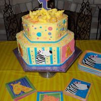 1St Birthday Cake - Safari Jungle 2 tier hexagon cake, 9 in and 12 inch. Tried to match invitation/party theme. Used color flow run outs to make the characters.