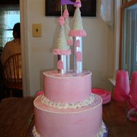 Pink Fairytale Castle Cake For my daughter's 4th birthday she wanted a castle cake. It's a 10" and a 6" covered in pink swiss meringue. Turets are...
